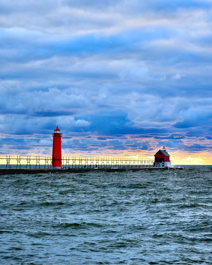Sunset over the pier and lighthouse at Grand Haven